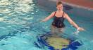 Underwater trampolinewith woman jumping on it